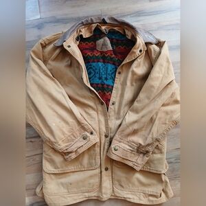 Woolrich Tan Field Jacket with Native American Buttons Saddle Blanket Liner.